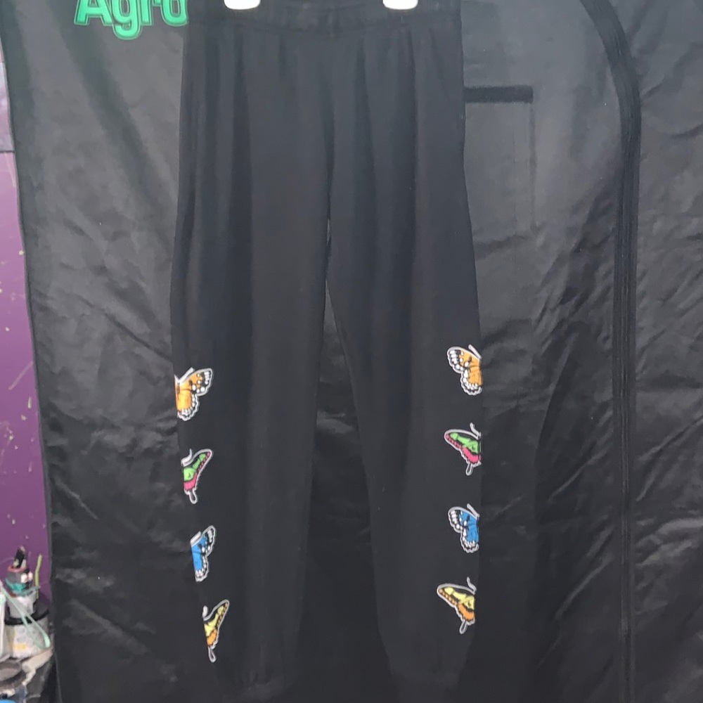 Empyre sweatpants butterfly detail black slight pilling on right inseam